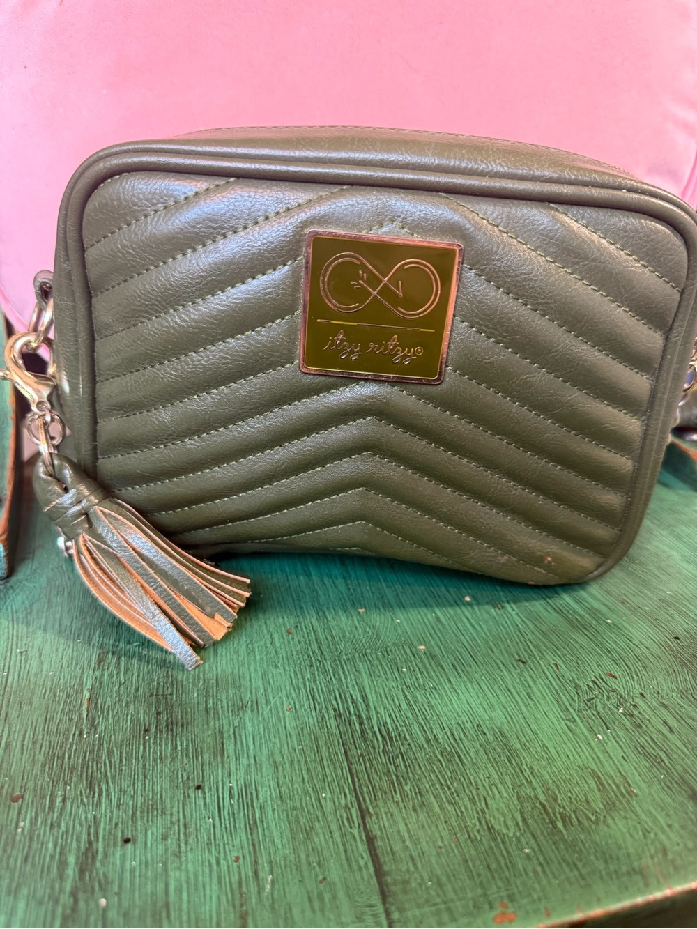 Itzy Ritzy Olive Quilted Crossbody Diaper Bag with Tassel Accent